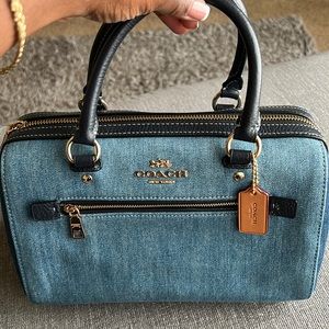 This is the Coach Rowan Denim Satchel